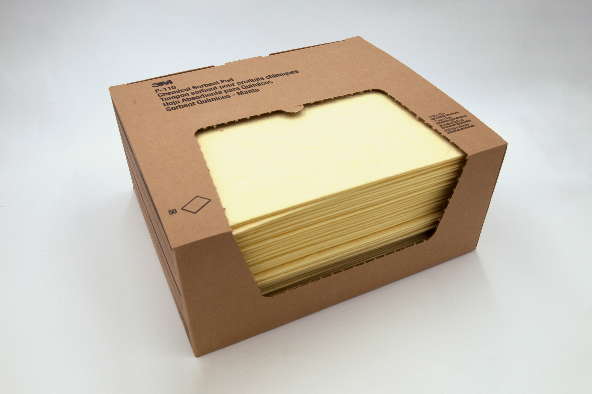 Cardboard package of absorbent pads on a white background