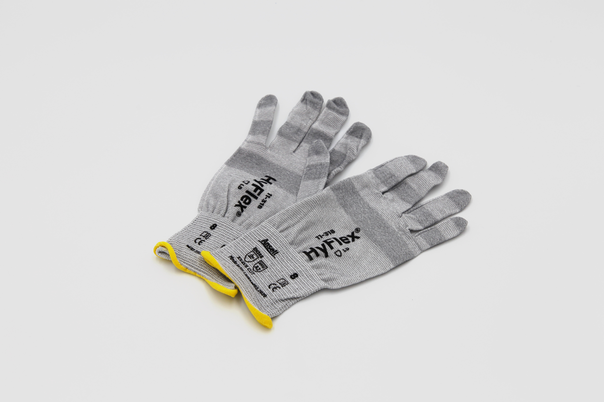 gray cut resistant gloves on white background