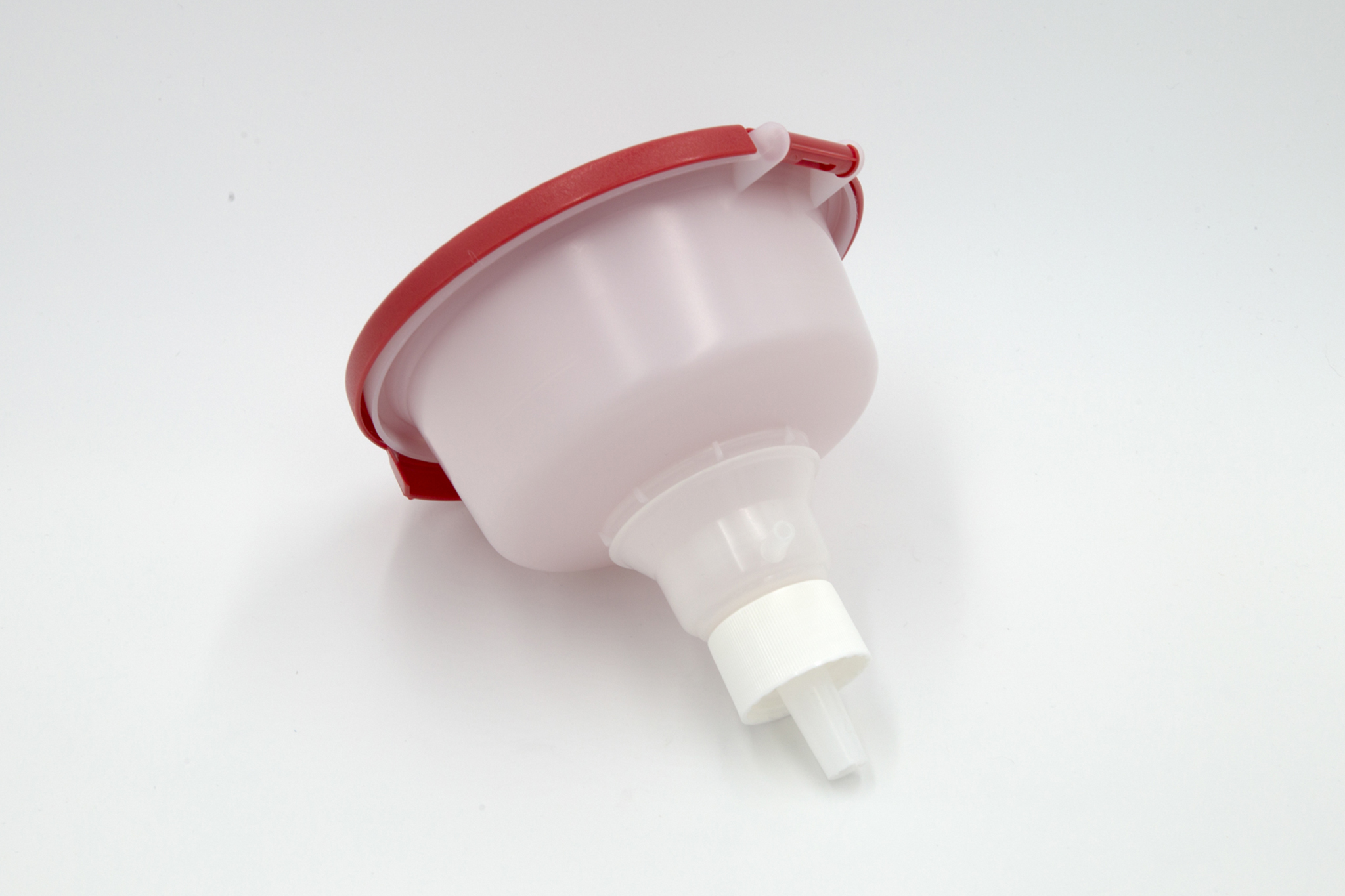 Red plastic funnel on a white background