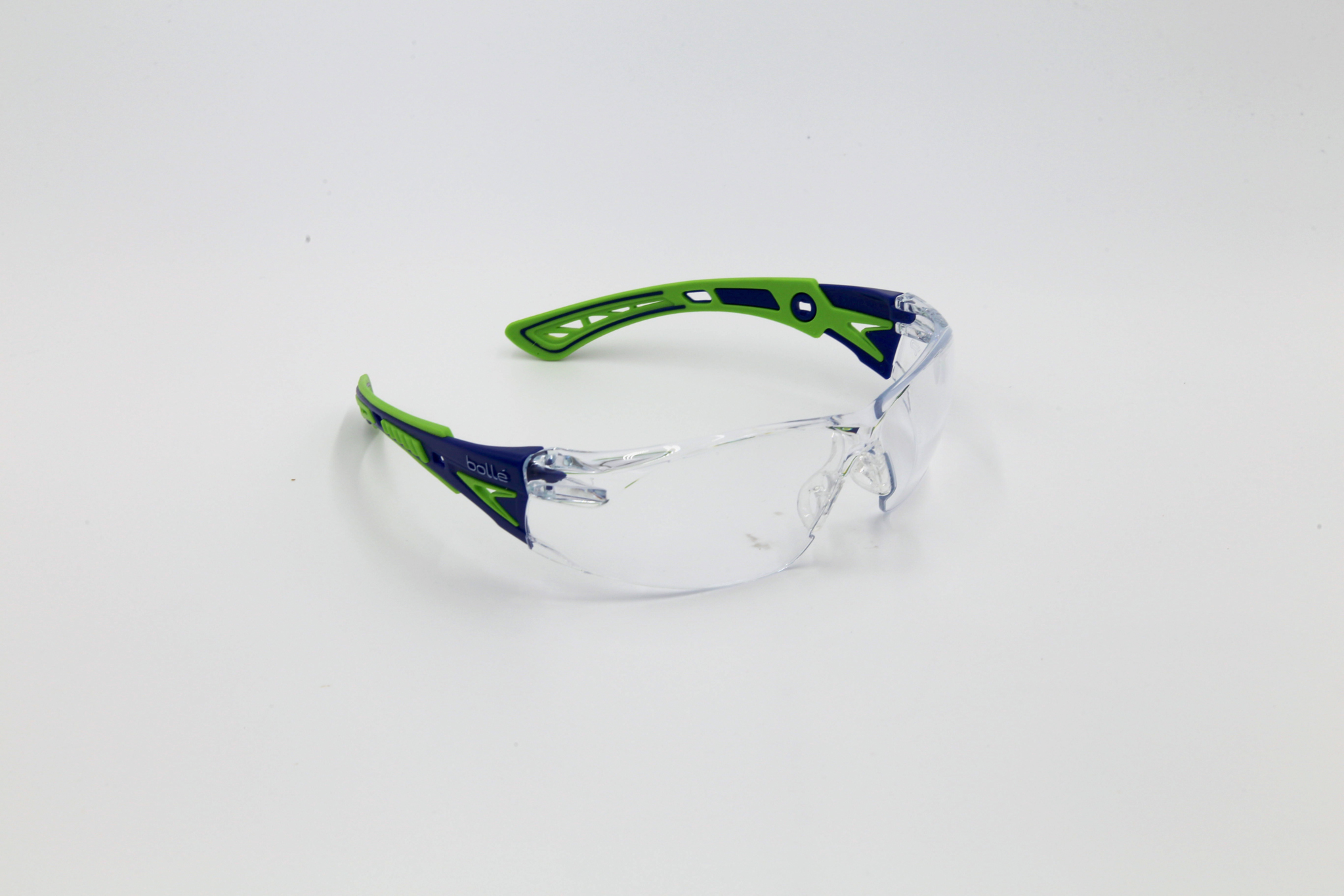 Green safety glasses on white background