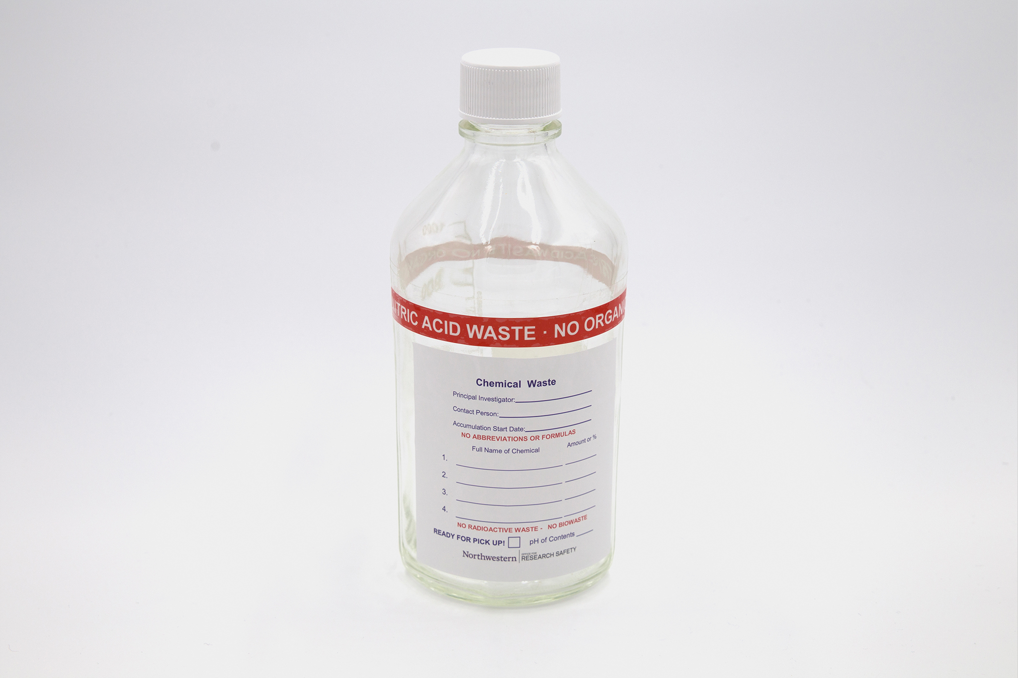 Clear waste bottle with nitric acid label on white background