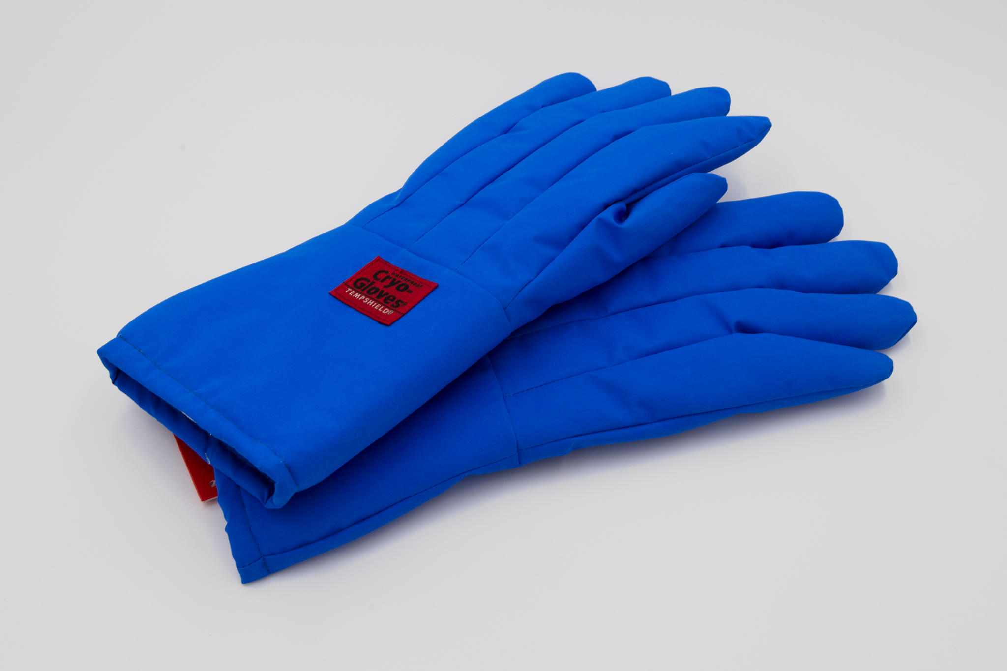 Blue gloves on white background