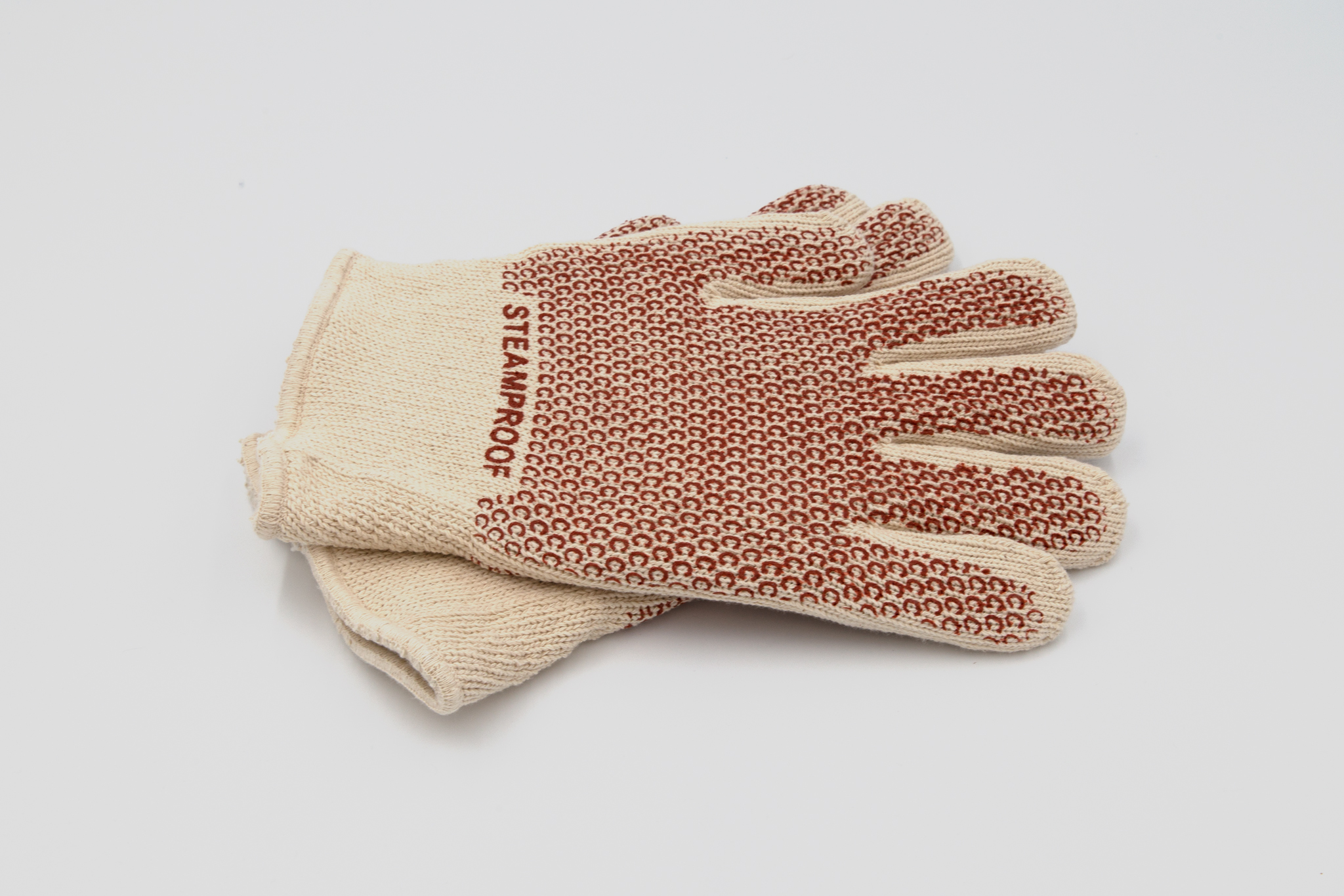 Beige and red gloves on a white background