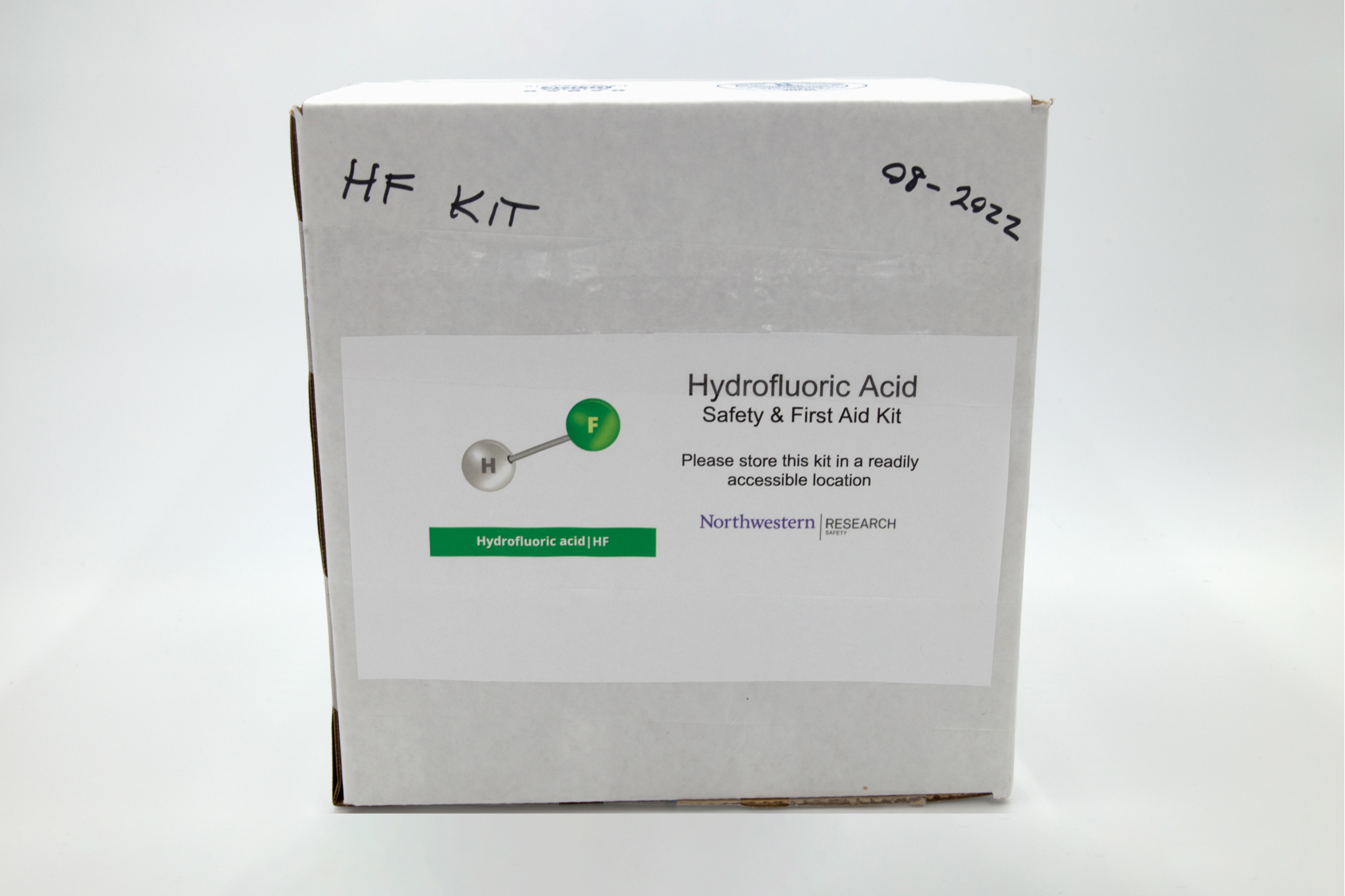 White cardboard box with "hydrofluoric acid spill kit" written on it