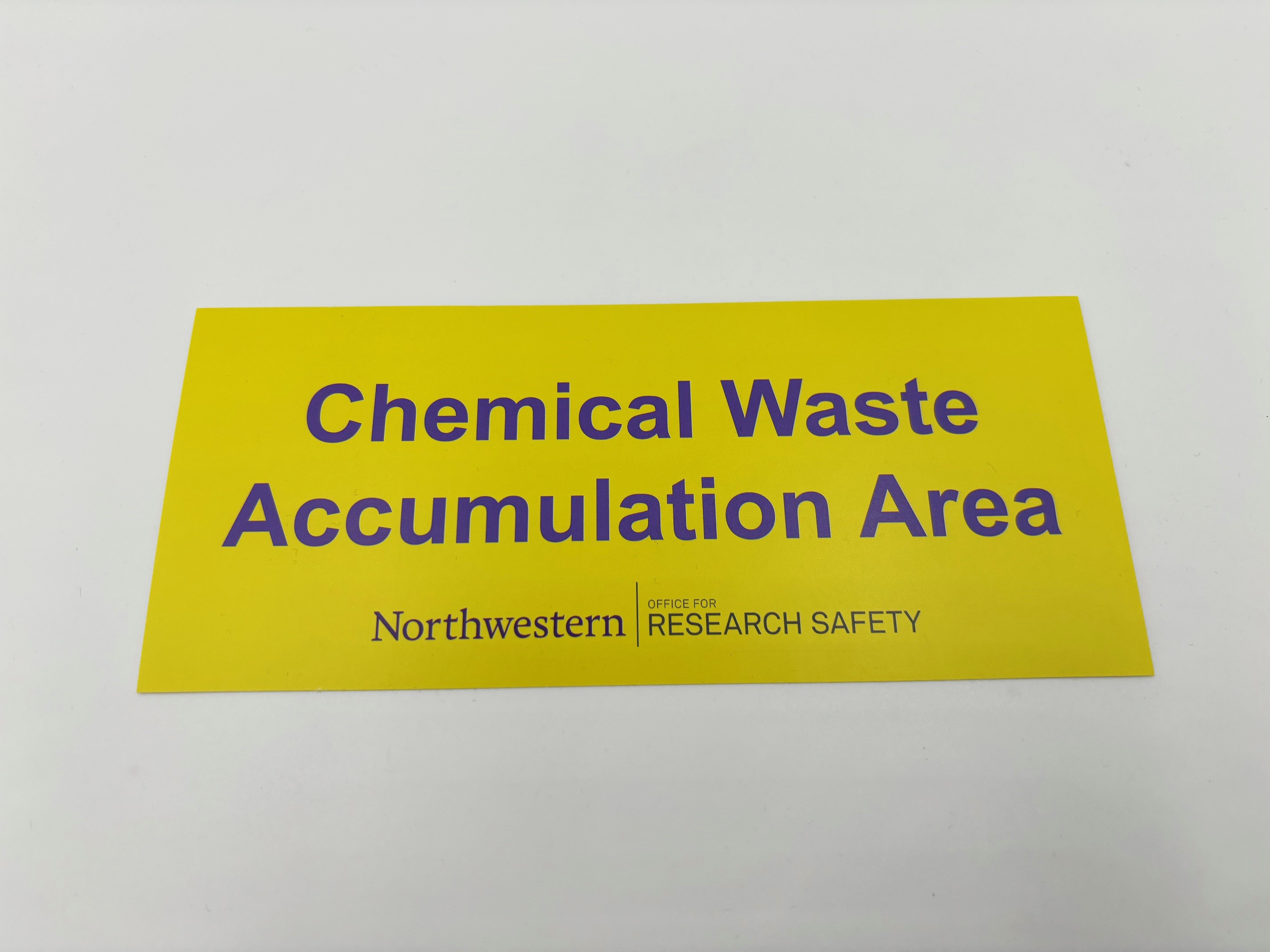 Yellow chemical waste accumulation area label